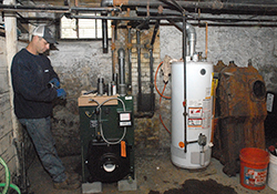 men repairing heating systems